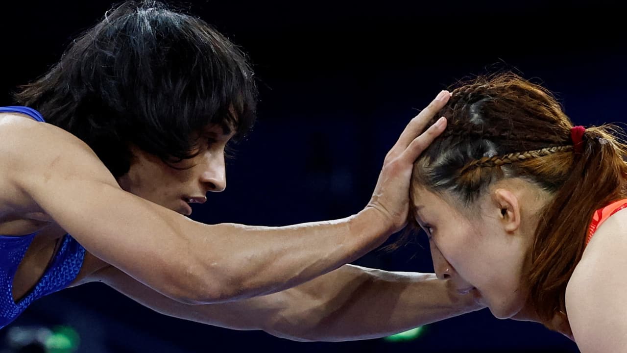 Facing reigning champion Yui Susaki of Japan and trailing 0-2 with seconds left on the clock, Vinesh pulled off a memorable manoeuvre which fetched three points (Reuters Photo) Facing reigning champion Yui Susaki of Japan and trailing 0-2 with seconds left on the clock, Vinesh pulled off a memorable manoeuvre which fetched three points (Reuters Photo)