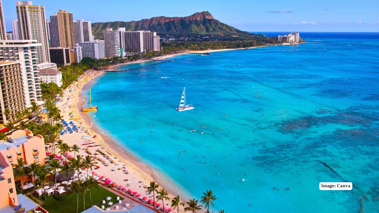 2. Waikiki Beach, Hawaii, USA This iconic beach offers classic tropical sunsets with volcanic Diamond Head as a dramatic backdrop—making it a dream spot for beach lovers and surfers alike. (Image: Canva)