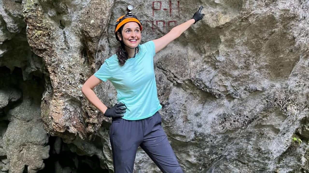 She spent four days in the cave without network, electricity, or washrooms, facing intense humidity and pitch-dark silence. She spent four days in the cave without network, electricity, or washrooms, facing intense humidity and pitch-dark silence.