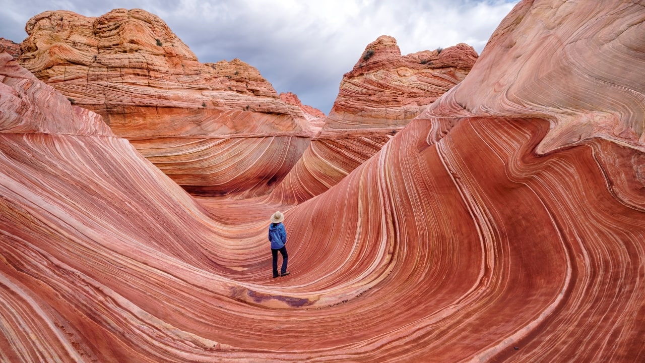 5. The Wave, Arizona, USA A stunning sandstone formation carved by wind and water, The Wave’s swirling, wave-like patterns shimmer in warm reds and oranges. Its unique geology and vibrant hues attract hikers and photographers from around the world. (Image: Canva)