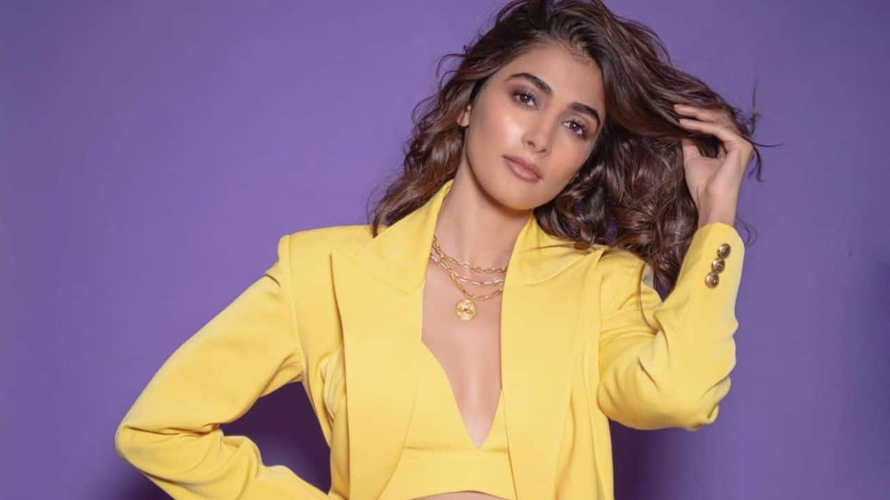 Yellow Pantsuit: Channeling boss-girl energy, Pooja stunned in a bright yellow pantsuit paired with a matching bralette. She kept it contemporary with a stacked neckpiece, adding a bold finishing touch.