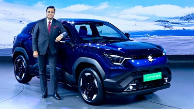 Maruti Suzuki's Senior Executive Officer for Marketing and Sales, Partho Banerjee, with the new e Vitara.