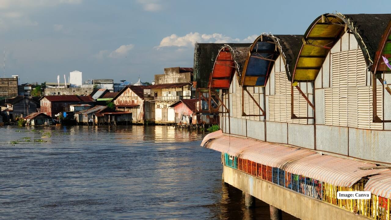 2. Banjarmasin, Indonesia Called the “City of a Thousand Rivers,” Banjarmasin is alive with waterways and culture. The floating markets here are a must-see, where vendors sell fresh produce and local goods straight from their boats. A river cruise reveals unique stilt houses and the lively rhythm of river life. (Image: Canva)