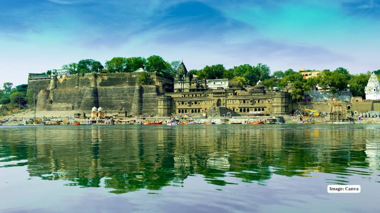 7. Maheshwar, India On the banks of the sacred Narmada River, Maheshwar is a serene spiritual retreat. Famous for its beautiful ghats and handwoven saris, this town invites visitors to explore Ahilya Fort, enjoy a sunset boat ride, or simply take in the calm atmosphere. (Image: Canva)