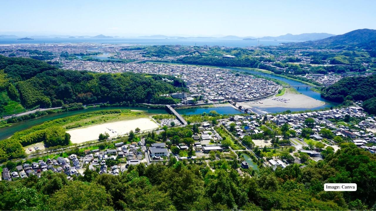 8. Iwakuni, Japan Iwakuni is known for the iconic Kintai Bridge spanning the Nishiki River. The riverbanks are a favorite spot for cherry blossom viewing in spring. Visitors can also tour Iwakuni Castle or experience traditional cormorant fishing for a glimpse into local heritage. (Image: Canva)