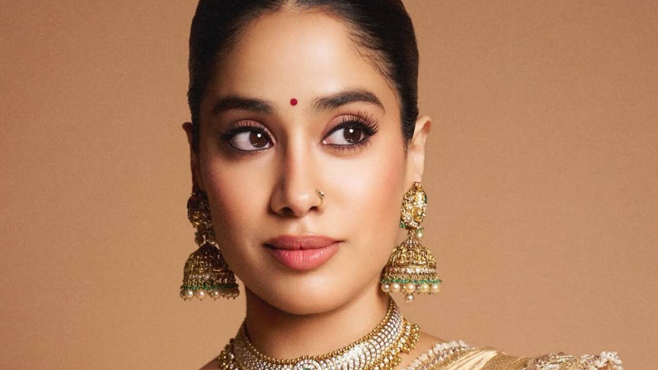 2. The heavily embellished blouse features intricate bead and sequin work, adding a regal touch to the ensemble.