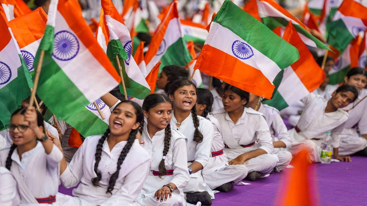 School students participate in the 'Tiranga Yatra' at Connaught Place in New Delhi.