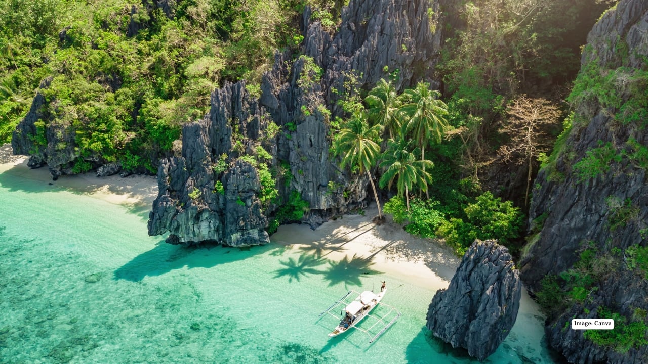 2. Palawan, Philippines Palawan dazzles with emerald lagoons, limestone cliffs, and hidden caves. Kayak the Bacuit Archipelago, snorkel in crystal-clear waters, or unwind on El Nido’s secluded beaches for a tropical adventure. (Image: Canva)