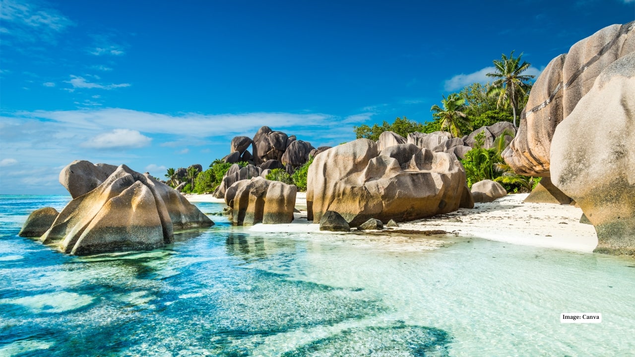 10. Seychelles Seychelles offers idyllic beaches, granite cliffs, and unique wildlife. Visit Vallée de Mai’s palm forest, snorkel in pristine waters, or discover secluded coves for a blend of adventure and relaxation. (Image: Canva)