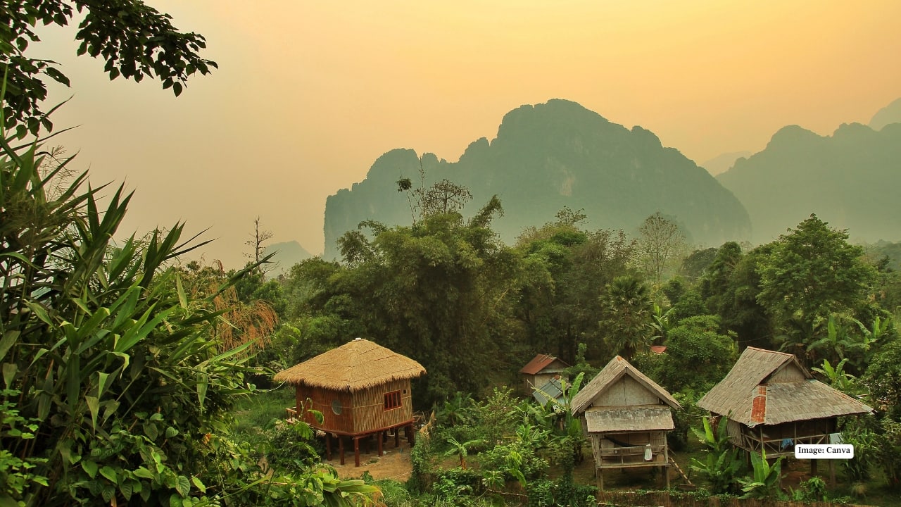 3. Vang Vieng – Adventure seekers’ paradise with dramatic limestone karsts, hidden caves, and river tubing. Trekking, kayaking, and even hot air balloon rides make this town thrilling. (Image: Canva)