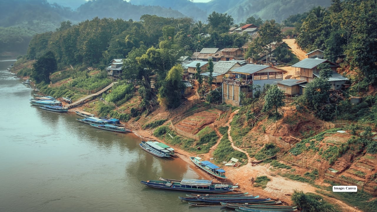 9. Nong Khiaw – A serene riverside village surrounded by towering cliffs. Great for trekking, kayaking, exploring local villages, and enjoying panoramic viewpoints of the Nam Ou River valley. (Image: Canva)