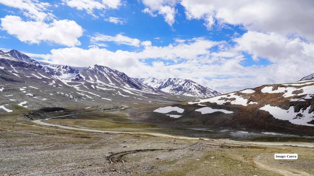 Baralacha La Where roads meet rivers and snowfields, Baralacha La on the Manali-Leh route is a surreal landscape. Its high-altitude beauty and remote charm make it a favorite among road trip enthusiasts. (Image: Canva)