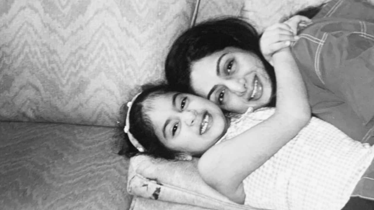 Candid embrace In this candid moment, Sridevi and Janhvi Kapoor flashed a stunning smile for the cameras. Janhvi hugged her mother in this black and white photo, showing a strong mother-daughter bond.