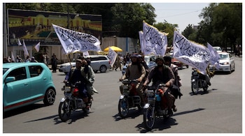 Members of the Taliban carrying flags ride motorbikes as they participate in a rally in Kabul. (Courtesy: Reuters file photo)