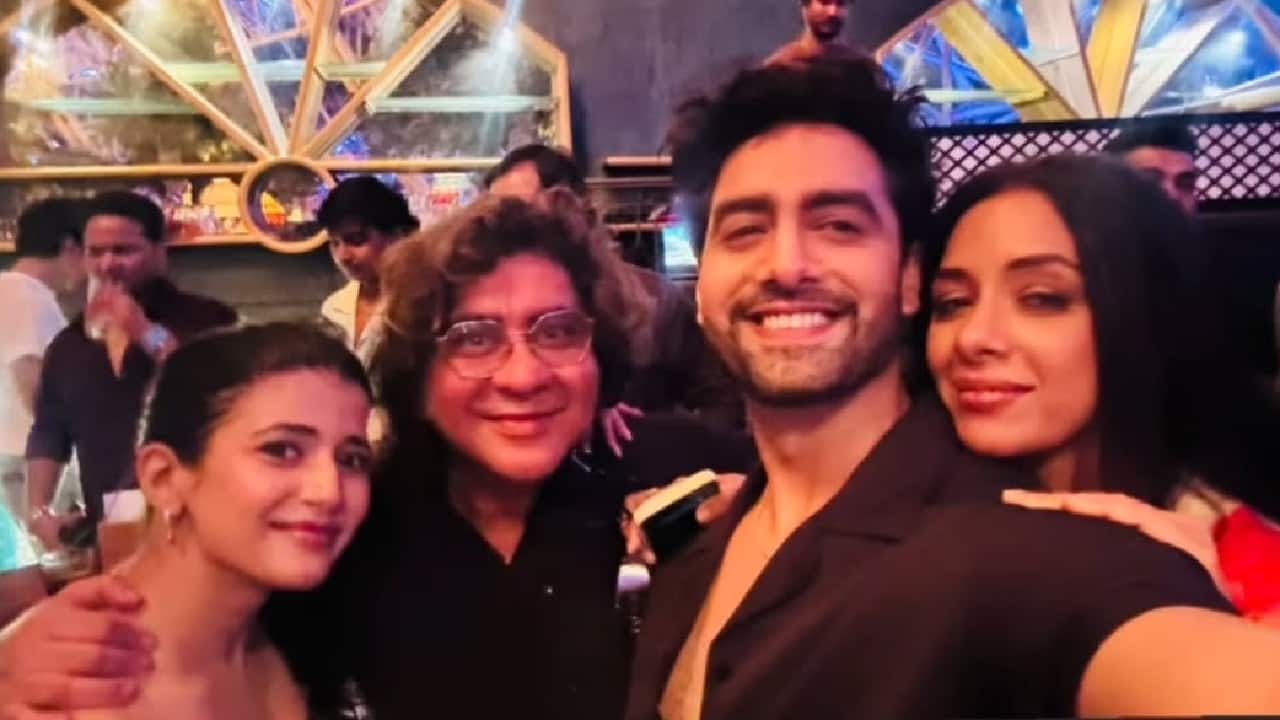 Outfit for the evening For her birthday party, she donned a stunning purple and white off-shoulder gown that perfectly complemented the festive atmosphere of the Boho Bar. The dress featured a delicate blend of purple and white, possibly with intricate details or patterns, adding to its visual appeal.