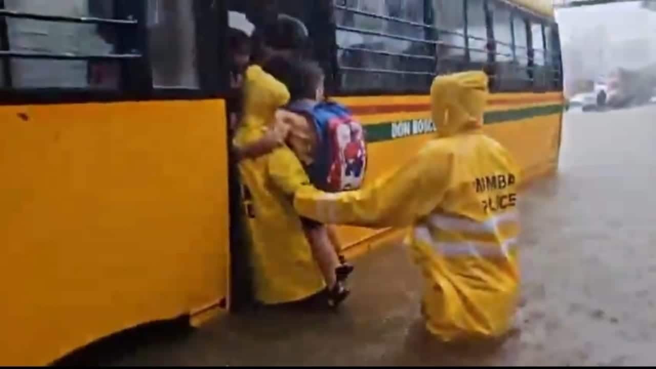 6 children among 8 stuck in school bus on flooded Mumbai road; rescued A school bus carrying six children and two staffers got stuck on a waterlogged road after heavy rains on Monday, following which police rushed to the spot and rescued them, PTI reported. (Photo: X)
