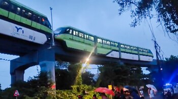 Elevated Mono Rail gets stuck between Mysore Colony and Bhakti Park stations amid heavy rains in Mumbai; cranes being used for rescue. (PTI)