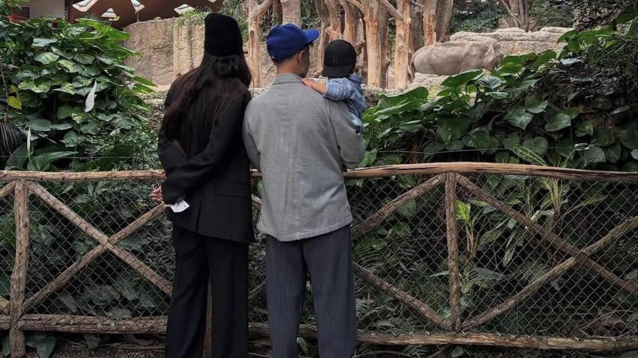 A visit to Zoo Vayu enjoyed a visit to the zoo with mom Sonam and dad Anand. The picture captures Sonam and Anand watching the elephant while the father carrying Vayu in his arms.