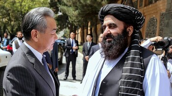 This handout photograph taken on August 20, 2025 and released by Afghanistan's Ministry of Foreign Affairs shows Afghanistan's Foreign Minister Amir Khan Muttaqi (R) welcoming China's Foreign Minister Wang Yi before their meeting in Kabul. (Photo by Afghanistan's Ministry of Foreign Affairs / AFP)