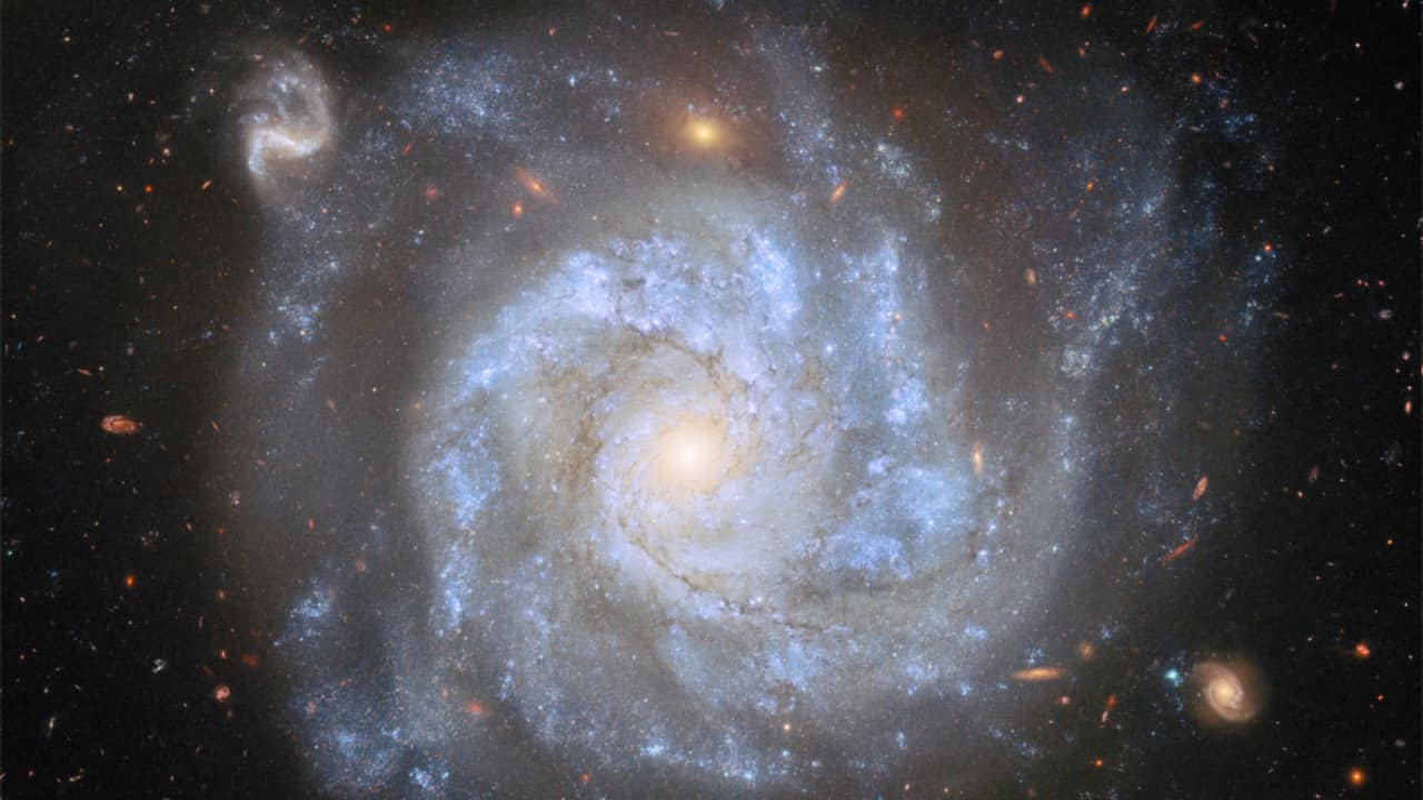 A Useful Spiral Galaxy: Spiral galaxy NGC 1309, 100 million light-years away, dazzles with young blue stars and supernovas, helping scientists refine measurements of the universe’s expansion. (Image: NASA)