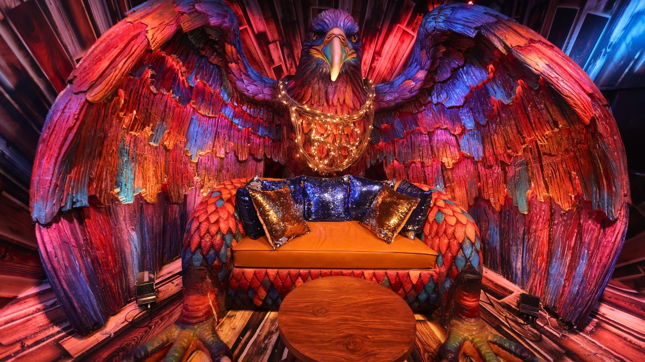 Dazzling Eagle chair While the details of this room are yet to be revealed, the huge Eagle-shaped chair is the highlight of the house. The brightly painted eagle with wings spread wide, encircling a tiny sofa with its hands, has a theatrical vibe. Dazzling Eagle chair While the details of this room are yet to be revealed, the huge Eagle-shaped chair is the highlight of the house. The brightly painted eagle with wings spread wide, encircling a tiny sofa with its hands, has a theatrical vibe.