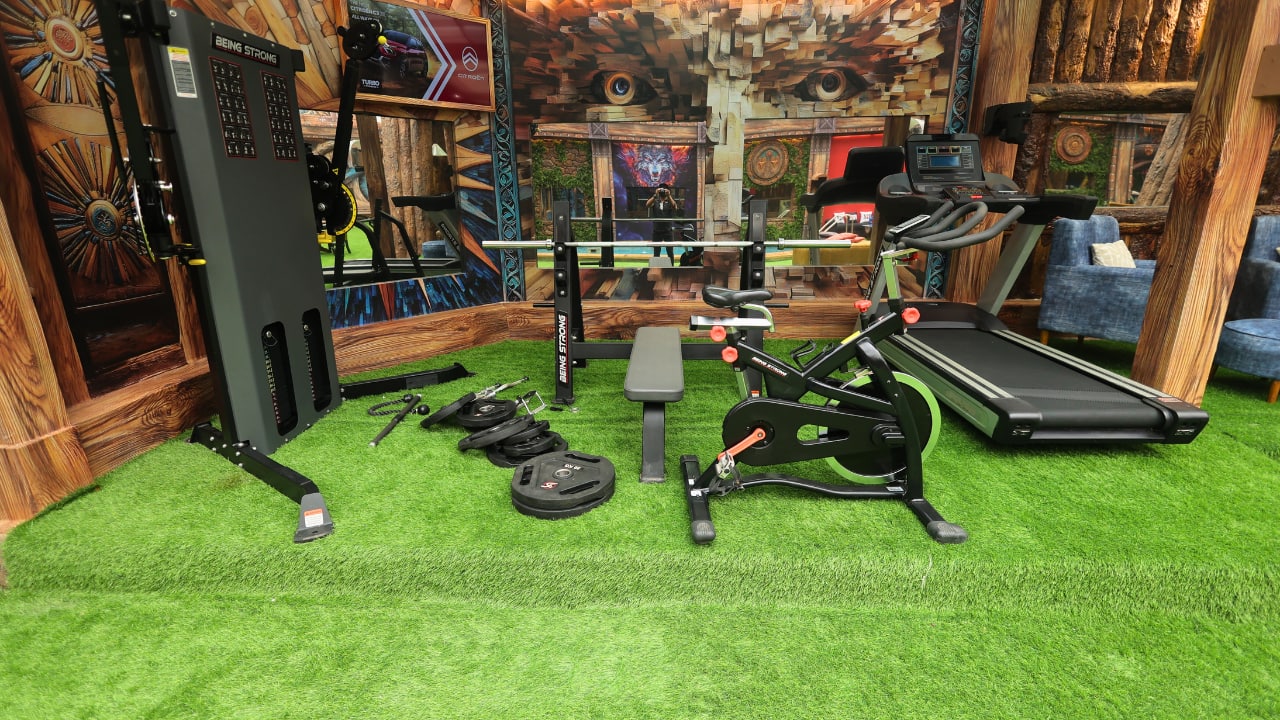 Indoor gym Bigg Boss house features a mini gym for the fitness freak contestants, as they don’t miss their workout sessions. The mini gym features all the essential equipment that’s enough for regular sessions. Indoor gym Bigg Boss house features a mini gym for the fitness freak contestants, as they don’t miss their workout sessions. The mini gym features all the essential equipment that’s enough for regular sessions.