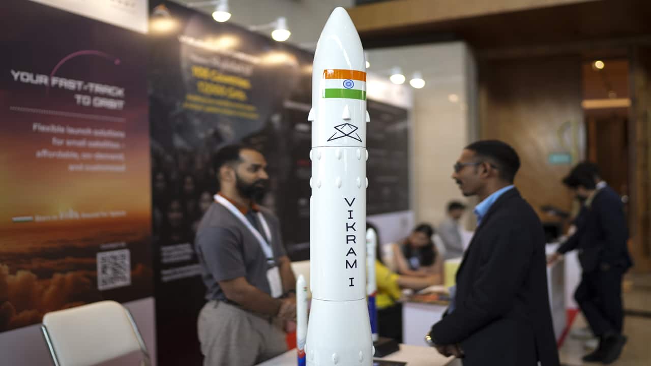 Visitors at a stall during the unveiling of first look of the Bharatiya Antriksh Station  (BAS) on the occasion of the National Space Day, at Bharat Mandapam, in New Delhi.