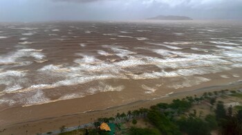 Waves approach Cua Lo beach, as seen through a window, while Typhoon Kajiki approaches in Nghe An province, Vietnam, August 25, 2025. REUTERS/Minh Nguyen