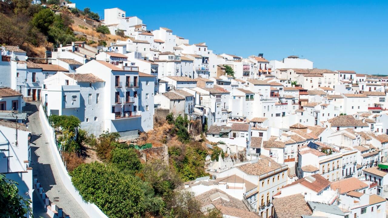 6. Setenil de las Bodegas, Spain Perched among olive groves in Andalusia, this 12th-century village is carved into rocks. Whitewashed cave dwellings now house cafés and shops—offering a surreal blend of history and earthy charm. (Image: Canva)