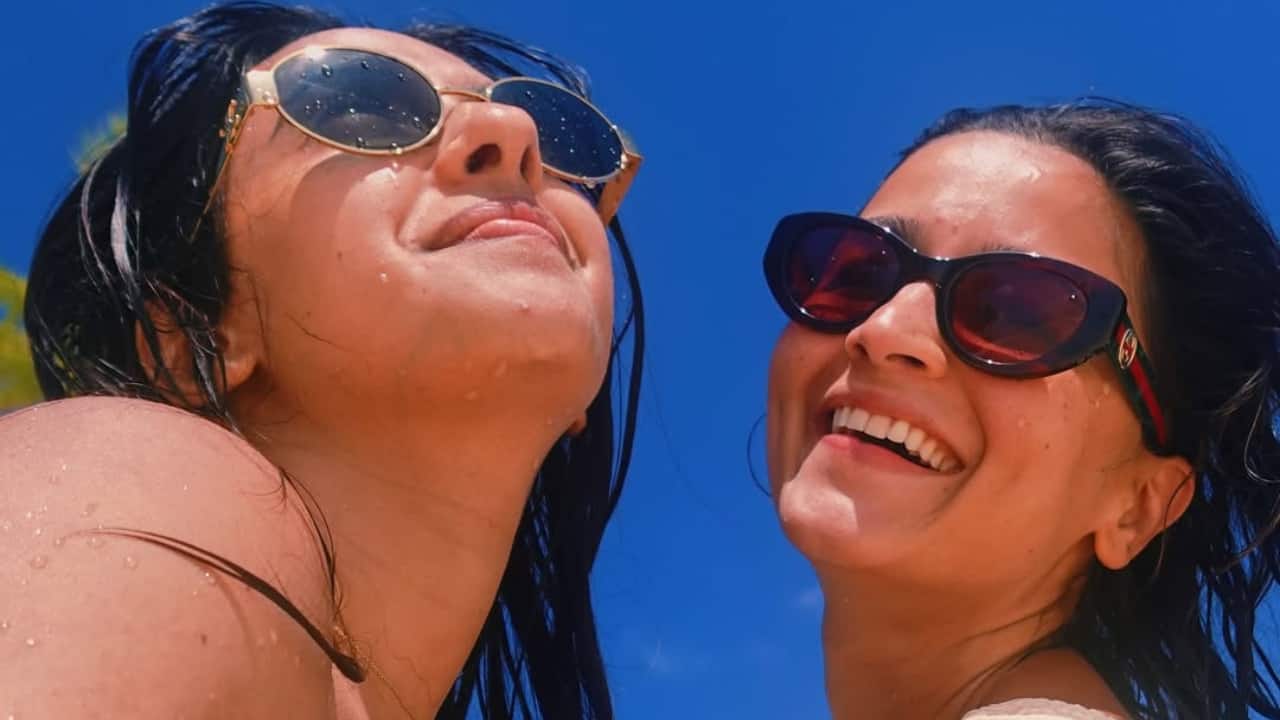 Alia looked radiant in a yellow monokini, perfectly complementing the sunny setting.