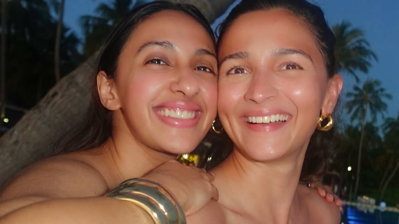 She accessorized her beach look with chunky gold jewellery and stylish sunglasses.