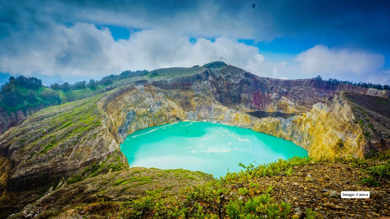 2. Kelimutu Lakes, Indonesia On Flores Island, three volcanic lakes change colors dramatically, from turquoise to deep red and even black. Local legends add mystical charm to this natural wonder. (Image: Canva)