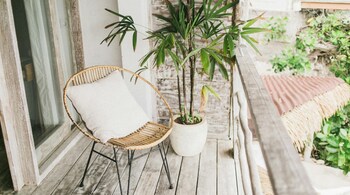 From flooring and furniture to plants and lighting, simple design tweaks can turn your balcony into the ultimate outdoor oasis for relaxation or entertaining. (Image: Pexels)