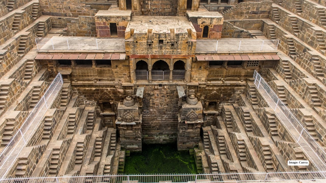 5. Chand Baori, Abhaneri — Paheli (2005), Bhool Bhulaiyaa (2007) Imagine 3,500 perfectly carved steps descending into mystery. Chand Baori, one of the world’s deepest stepwells, was made for cinematic drama. Whether it’s Rani Mukerji in Paheli or Vidya Balan’s eerie walk in Bhool Bhulaiyaa, the stepwell steals every scene. (Image: Canva)