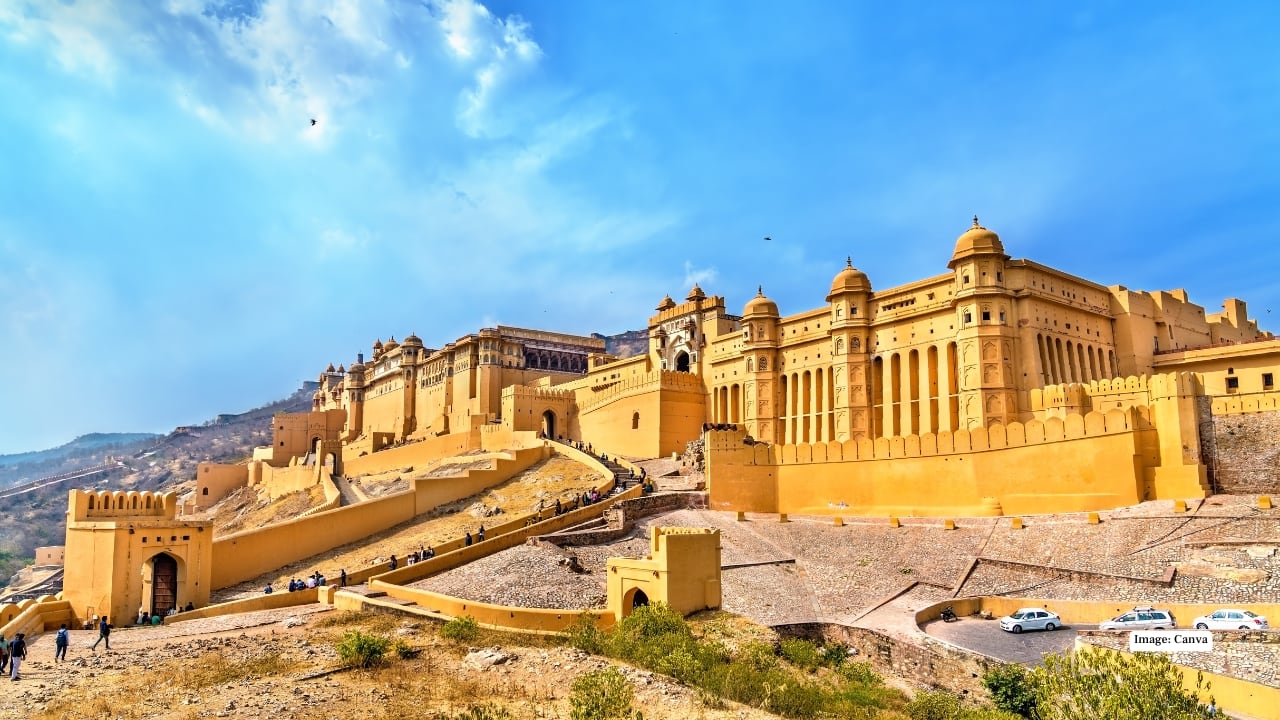 7. Amer Fort, Jaipur — Jodhaa Akbar (2008) With glittering Sheesh Mahal halls and mighty ramparts, Amer Fort gave Jodhaa Akbar its royal heartbeat. Even without the cameras, the fort is pure cinema—think mirror-lit chambers and elephants winding up the ancient pathways. (Image: Canva)