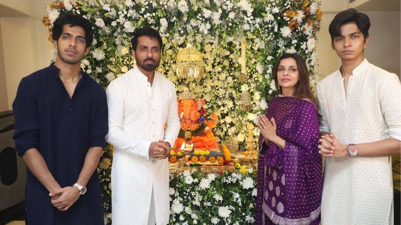 Sonu Sood Sonu Sood celebrated Ganesh Chaturthi with his family, posing in front of an elaborate floral decoration surrounding a striking orange Ganpati idol. The actor, his wife, and sons were dressed in traditional kurta sets. Their devotion and festive spirit shone through the family portrait. Sonu Sood Sonu Sood celebrated Ganesh Chaturthi with his family, posing in front of an elaborate floral decoration surrounding a striking orange Ganpati idol. The actor, his wife, and sons were dressed in traditional kurta sets. Their devotion and festive spirit shone through the family portrait.