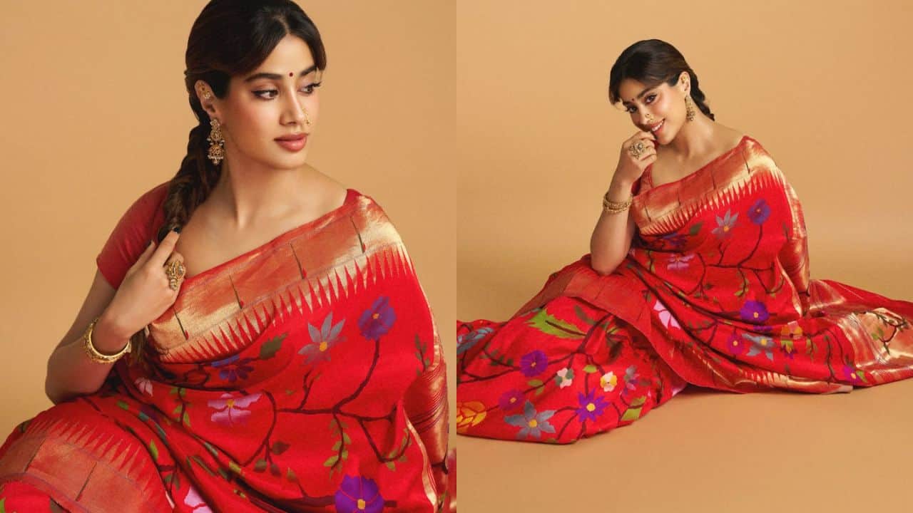 Janhvi Kapoor Janhvi Kapoor stuns in a vibrant red saree for her Ganpati look, adorned with beautiful floral patterns in contrasting colors. The saree’s golden border adds a regal touch, while her minimalist yet elegant styling enhances the festive appeal. She pairs it with traditional jewelry, including statement earrings, a nose ring, and bangles. Her braided hair and subtle makeup complete the look, radiating grace and charm, perfect for celebrating Ganesh Chaturthi in style.
