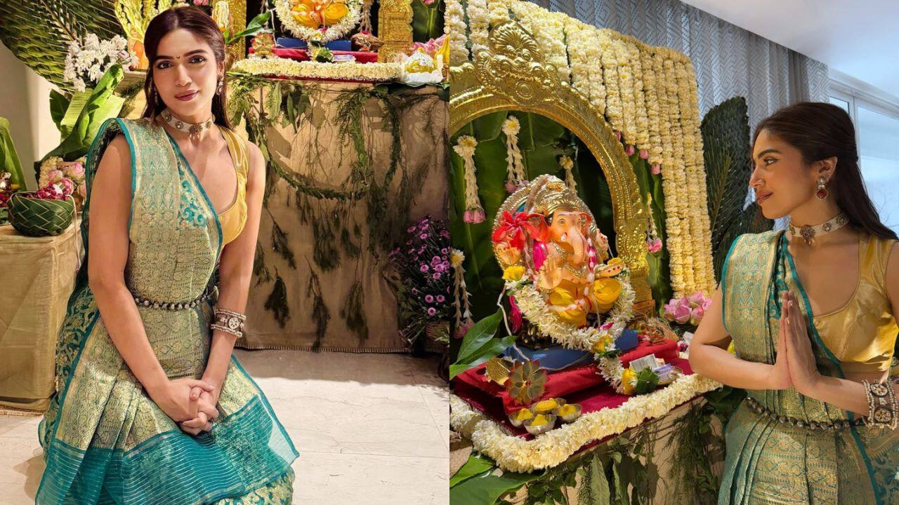 Bhumi Pednekar Bhumi Pednekar looks radiant in a traditional ensemble for her Ganpati celebration. She is dressed in a green and gold saree with intricate patterns and a contrasting yellow blouse. The saree is complemented with a belt, adding a chic twist to her classic look. Her jewelry, including a choker, statement earrings, and bangles, adds an elegant touch. Bhumi’s serene pose and soft makeup elevate the festive spirit, making her look effortlessly graceful.