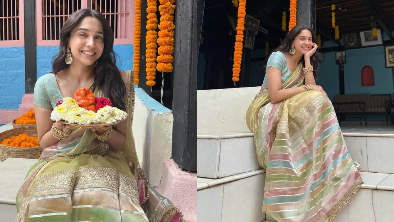 Sharvari In this Ganpati look, Sharvari Wagh looks graceful and vibrant in a beautiful pastel-colored saree with horizontal stripes in shades of green, pink, blue, and gold. She pairs it with a matching light blue blouse adorned with subtle gold motifs. Her traditional look is enhanced with statement jhumka earrings and delicate bangles. Sharvari’s natural makeup and radiant smile complement the festive atmosphere perfectly as she holds a plate with flowers and a Ganpati idol, exuding joy and devotion.
