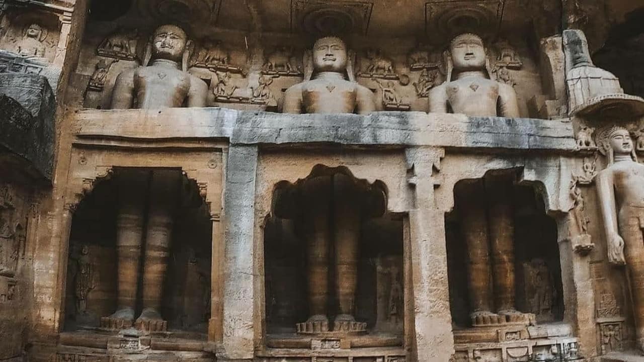 Experience the serenity of Siddhachal Jain Caves in Gwalior, where colossal statues whisper tales of faith. (Image: Facebook/ Secret Temples)
