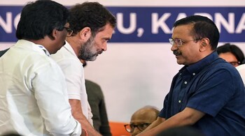 AAP convener Arvind Kejriwal with Congress MP Rahul Gandhi. (File: ANI)