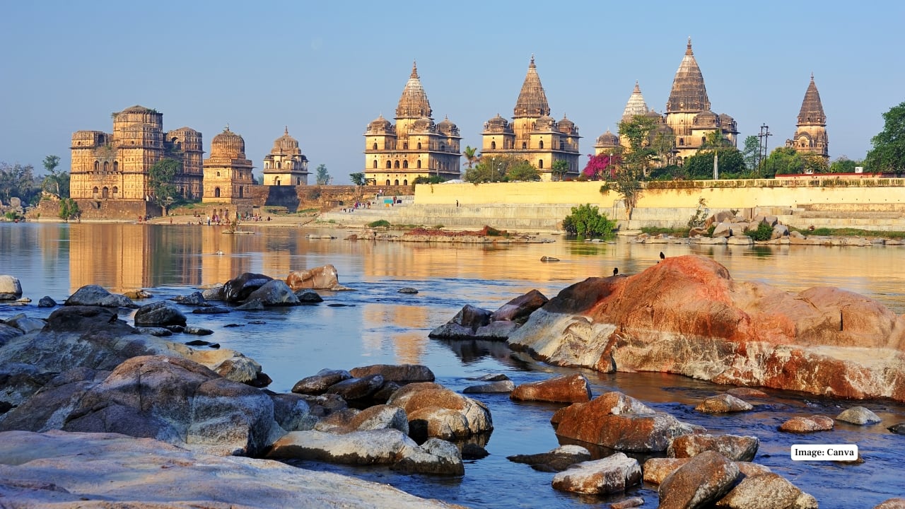 6. Betwa River and Cenotaphs – Romance by the Riverside The banks of the Betwa are lined with majestic Bundela chhatris (cenotaphs), their reflections in the water at sunset creating one of the most enchanting sights in Orchha. (Image: Canva)