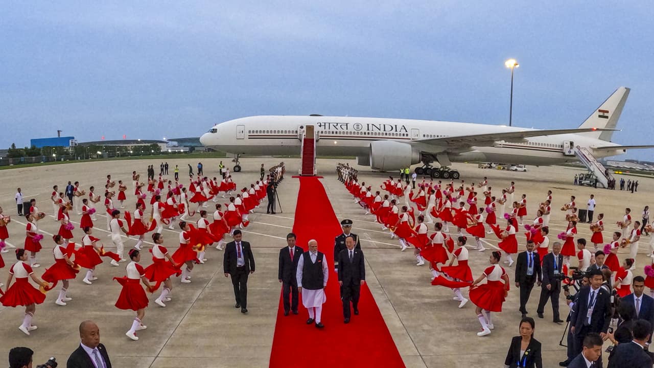 Prime Minister Narendra Modi being welcomed with a performance by artistes upon his arrival at the airport, in Tianjin, China.