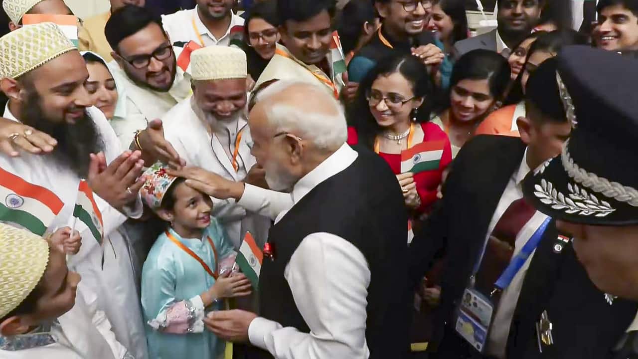Prime Minister Narendra Modi being welcomed by members of the Indian community upon his arrival, in Tianjin, China