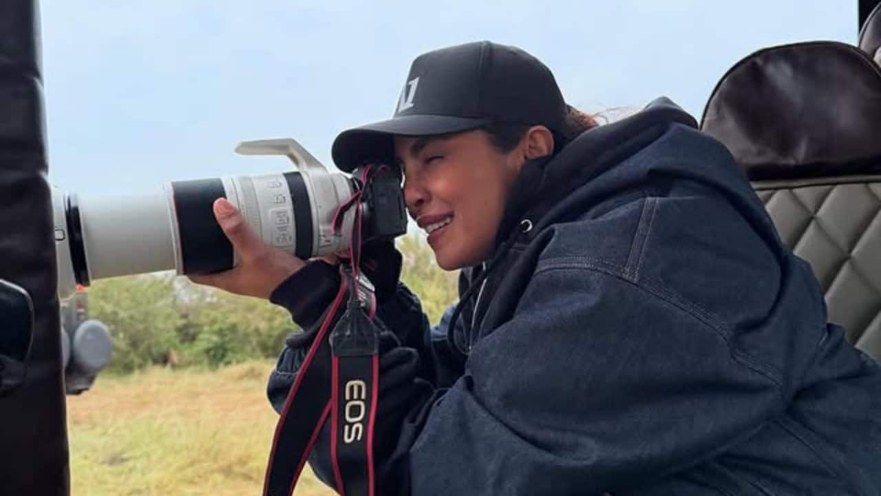 Wildlife Photographer Mode Priyanka turned photographer, captured mid-action with a Canon zoom lens while on a safari, radiating joy and adventure. Wildlife Photographer Mode Priyanka turned photographer, captured mid-action with a Canon zoom lens while on a safari, radiating joy and adventure.
