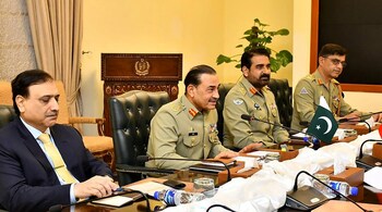 File Image - In this military handout photograph taken and released by Inter Services Public Relations (ISPR) on August 22, 2025, Pakistani Army Chief General Syed Asim Munir (2L) interacts with Chinese Foreign Minister Wang Yi during a meeting in Rawalpindi. 