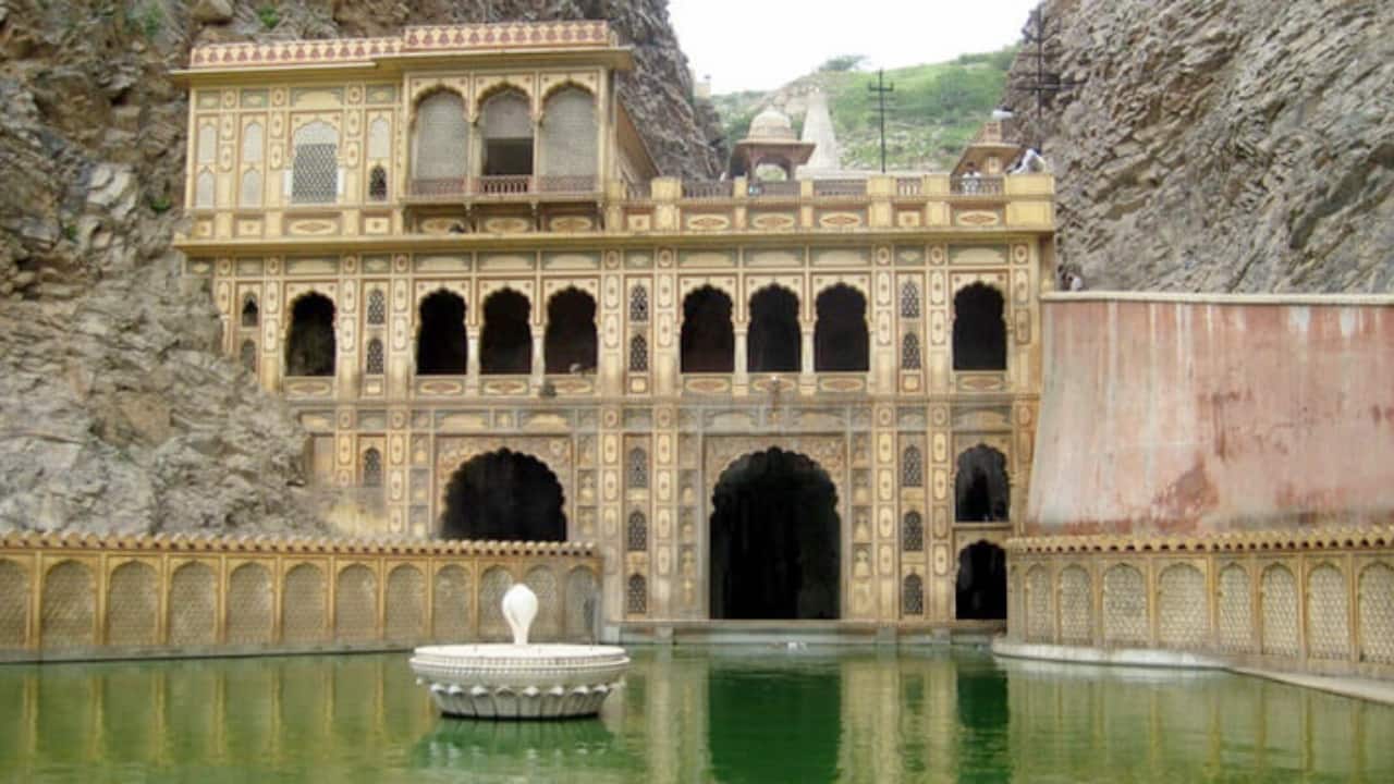 Legends and Historical Footprints Galta Ji has inspired poets, saints, and emperors alike. It is said that Tulsidas composed parts of the Ramcharitmanas here, while Guru Nabha Dass Ji wrote his Bhaktamal at the site. The ISKCON movement traces its roots to the Govind Bhashya, written in Galta Ji in 1718. Even Mughal Emperor Akbar once visited, donating over 2,500 bighas of land after his prayers were answered. (Image: Jaipur Tourism)