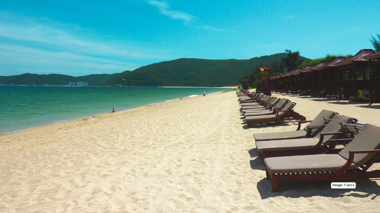 4. Yalong Bay, China Known as the “Hawaii of China,” Yalong Bay in Hainan combines golden sands, calm aquamarine waters, and palm-fringed resorts. It’s a family-friendly paradise that blends natural beauty with comfort, sunshine, and gentle island vibes. (Image: canva)