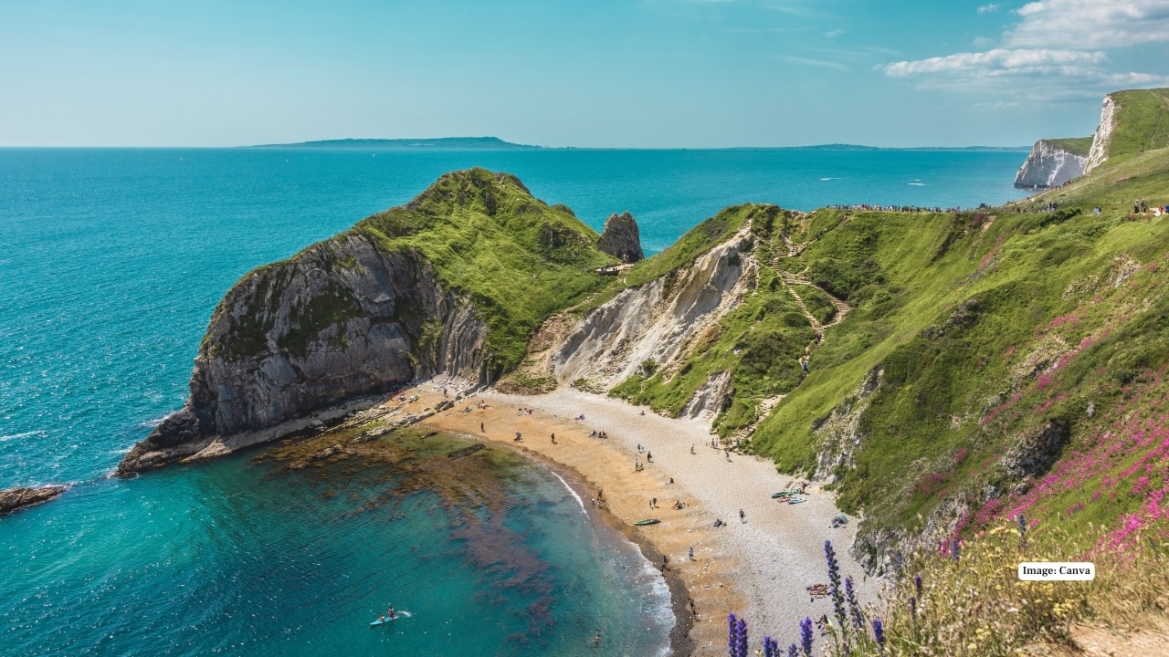 12. Man O’War Beach, England Tucked along Dorset’s Jurassic Coast, Man O’War Beach is framed by limestone cliffs and history written in its rocks. Its curved bay and aquamarine waters make it one of England’s most picturesque coastal escapes. (Image: canva)