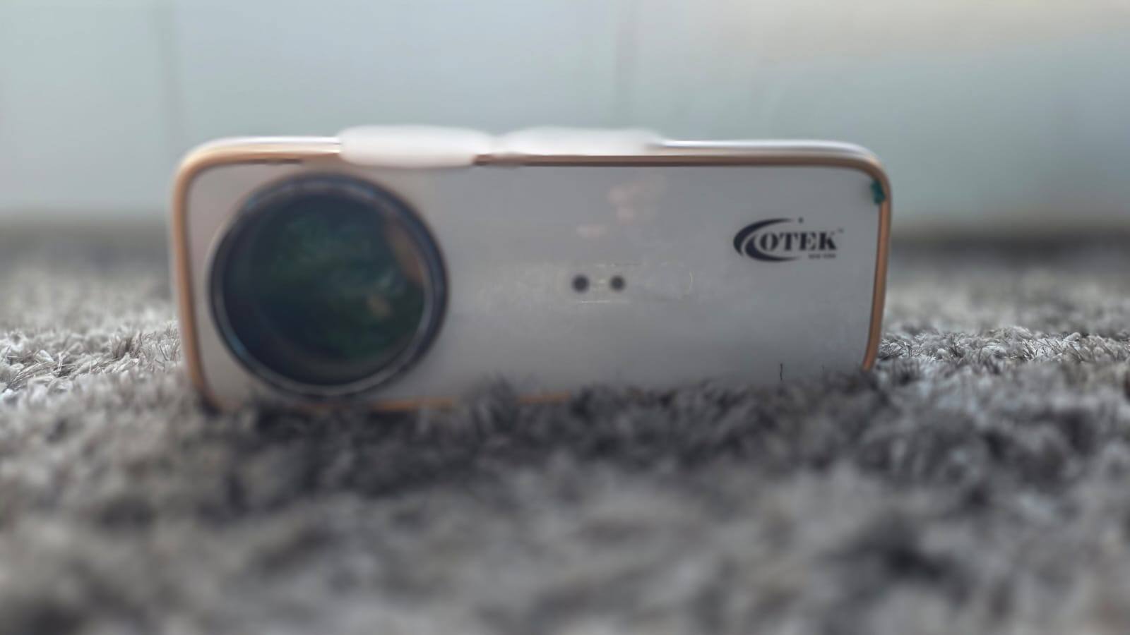 Smart features and ease of setup Where the OTEK Galaxy Smart Projector really tries to differentiate itself is in setup convenience. Features like auto focus, auto keystone correction, auto screen fit, and obstacle avoidance aim to eliminate the usual frustrations of projector alignment. In testing, autofocus quickly sharpens the image, while keystone correction keeps the projection rectangular even if the device isn’t perfectly centred. Obstacle avoidance is a thoughtful addition, automatically adjusting the projection to avoid interruptions like wall hangings. While all these features work as expected, the time it takes is a little more than what I was expecting. Again, this is something that most people won’t mind at this price point. That said, I have also seen a couple of other projectors at this price point which gets the job done relatively quicker. Powered by Android 13, the software interface feels modern, though occasional stutters can happen when running multiple apps. With 2GB of RAM and 32GB of onboard storage, it handles most OTT apps well. Do keep in mind that the projector comes with Google Play Store with third-party app support, but the Netflix app that comes pre-installed with it is the mobile version which limits the functionality overall and similar is the case with Prime Video app.